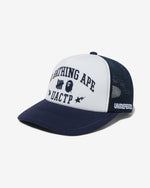 NAVY::A navy mesh cap with a white front panel with the words 'A Bathing Ape' above he Undefeated and Bape logos above the letters 'UACTP' on a white background.