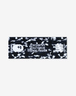 NAVY::A navy towel printed with black and white camo. The words 'A Bathing Ape Athletic Club Training Program' is printed in white on the middle. The Bape head icon is printed on the left of the towel with the word 'Undefeated' printed below it. The Undefeated 5-strike icon is printed on the right of the towel with the words 'A Bathing Ape' below the icon.
