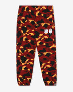 RED::A pair of red Undefeated and Bape sweat pants on a white background.