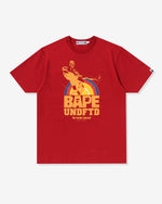 NAVY::A red Undefeated and Bape t-shirt with the words 'Bape,' 'UNDFTD,' and 'No holds barred' on a white background.